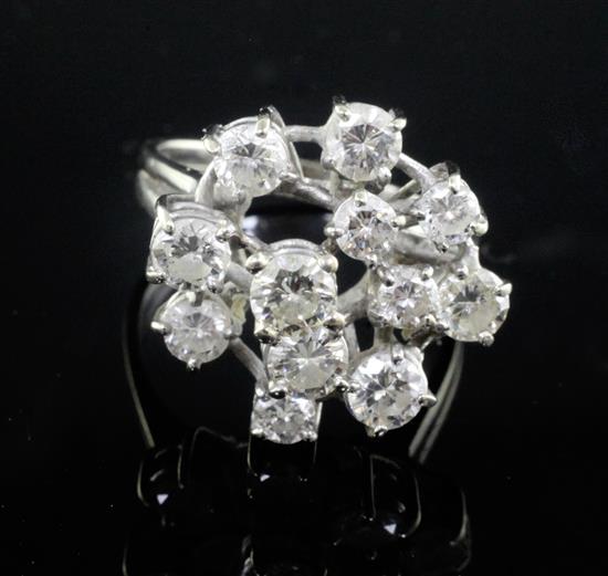 An 18ct white gold and free form diamond cluster ring, size L.